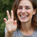 A person celebrating a small victory, symbolizing sustainable long-term habits.