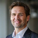 Portrait of a fit man in his 40s, looking confident, representing 'Michael T'.